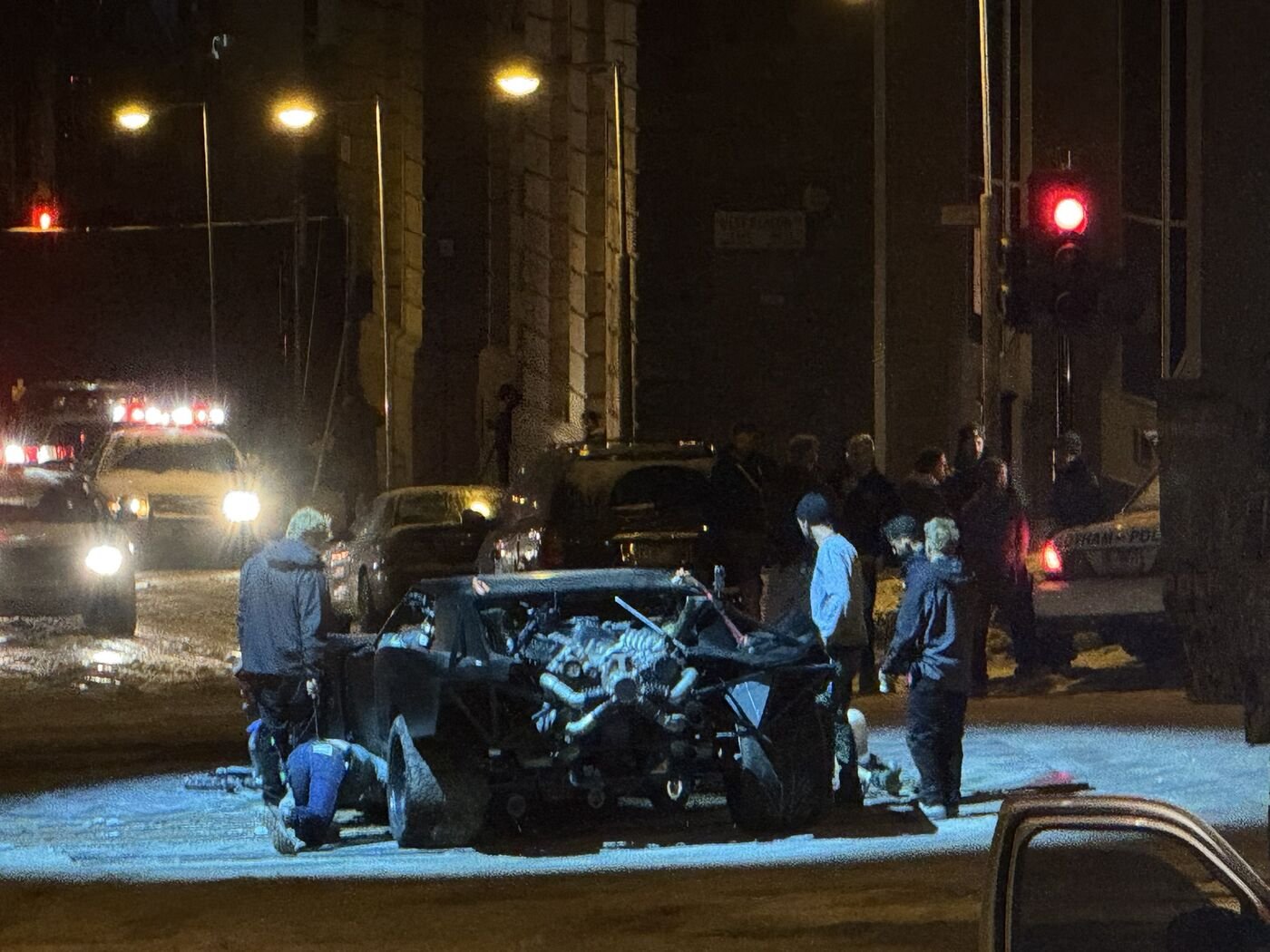 Batmobile on a snow dressed Glasgow street at night during The Batman Part II filming
