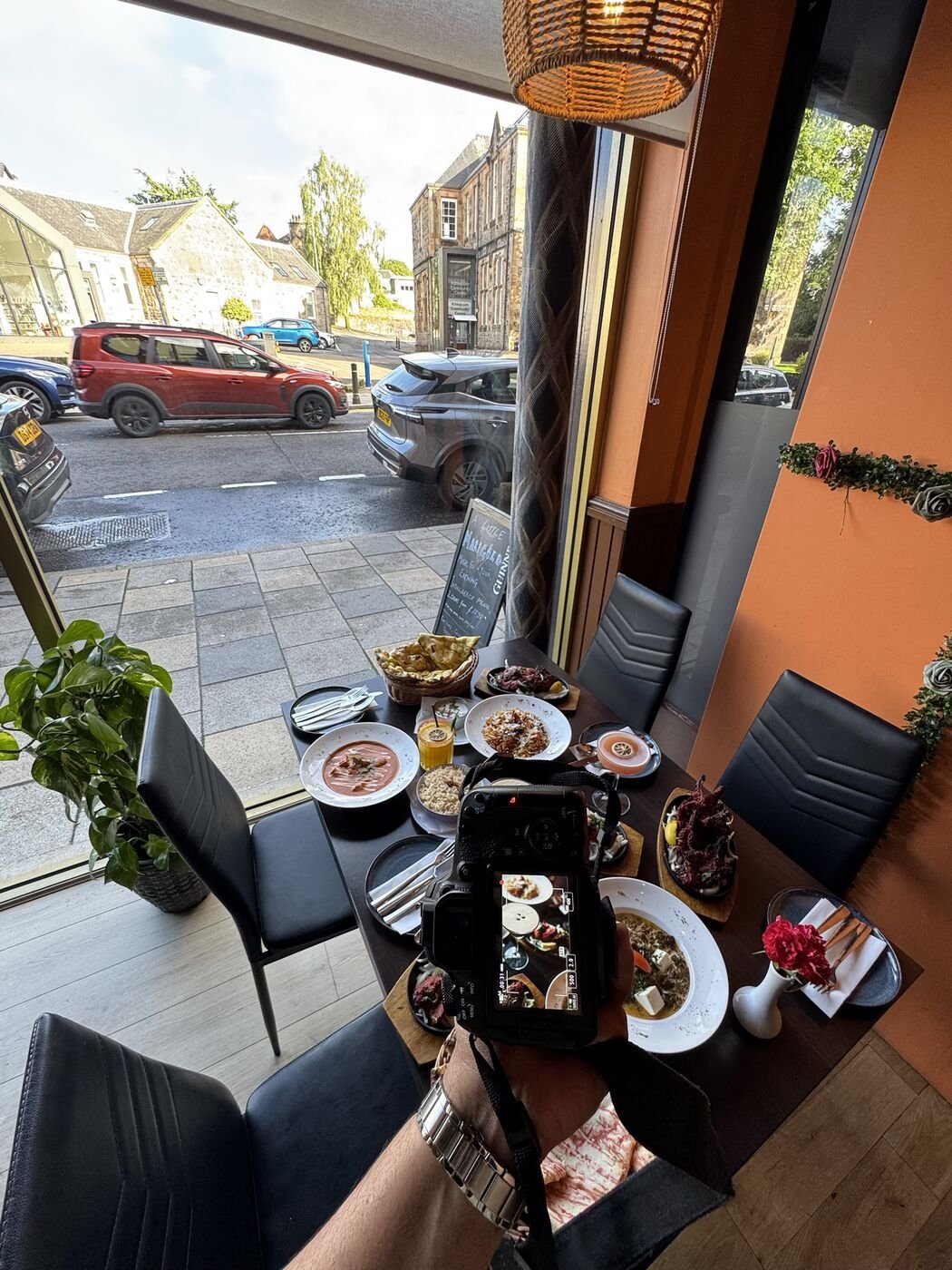 Behind the scenes of a restaurant shoot in Kilmacolm, camera on a table of dishes