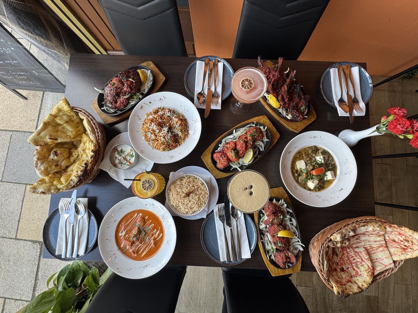 Overhead table of Indian dishes at Marigold, Kilmacolm, restaurant social media content